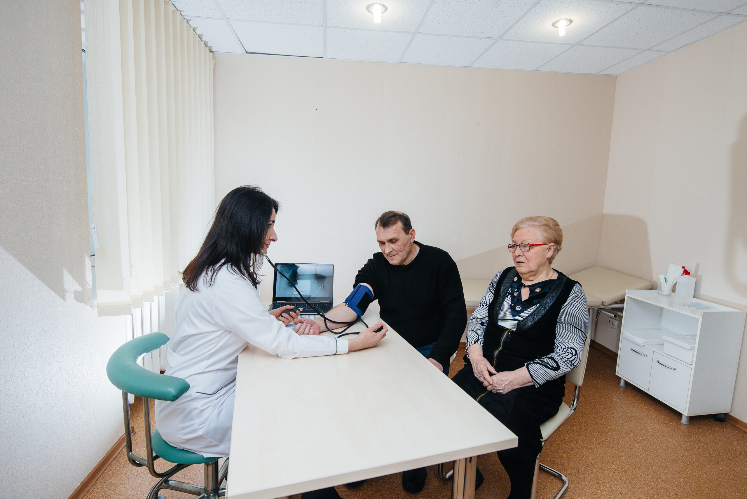 A couple of elderly people are conducting a medical examination at a medical center. Medicine and healthcare.